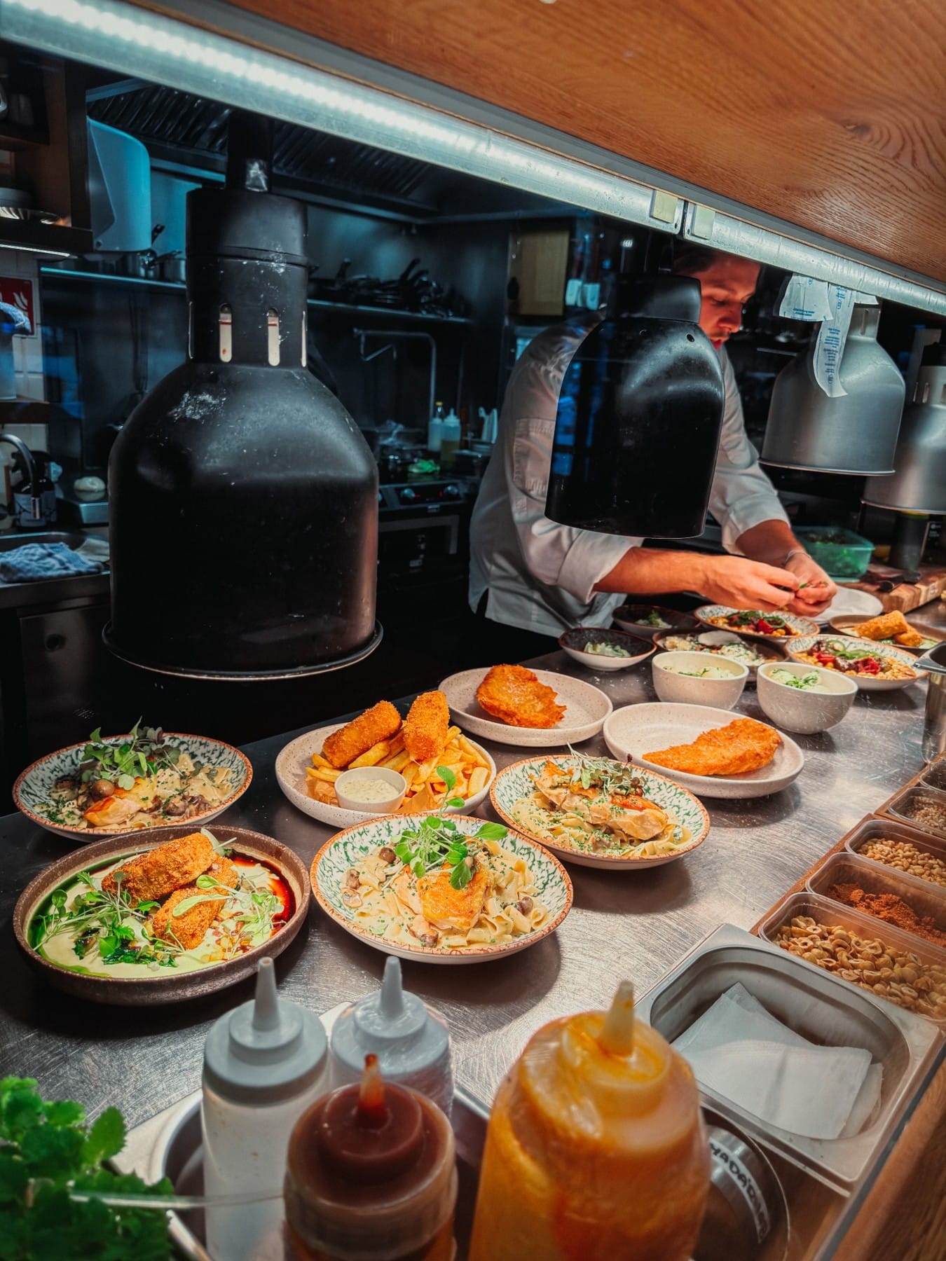 Kismező’s chef preparing Hungarian dishes in the open kitchen
